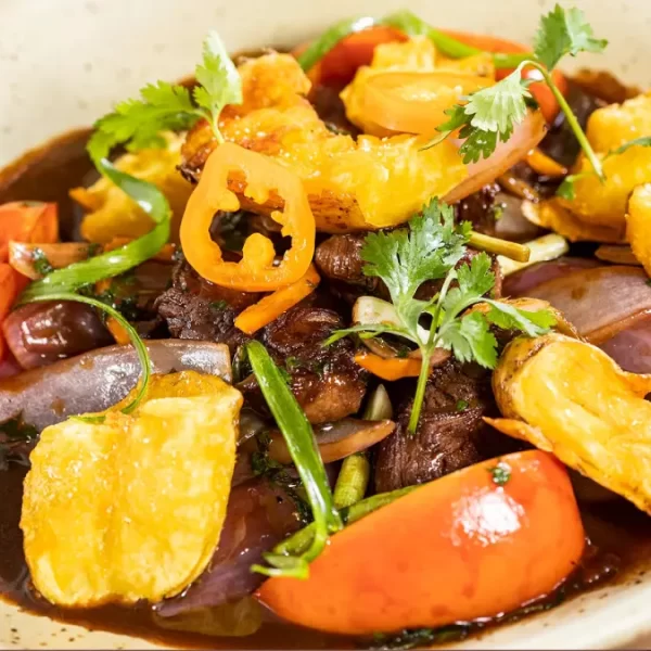 Lomo saltado dish served at Chicha restaurant in Cusco, Peru.