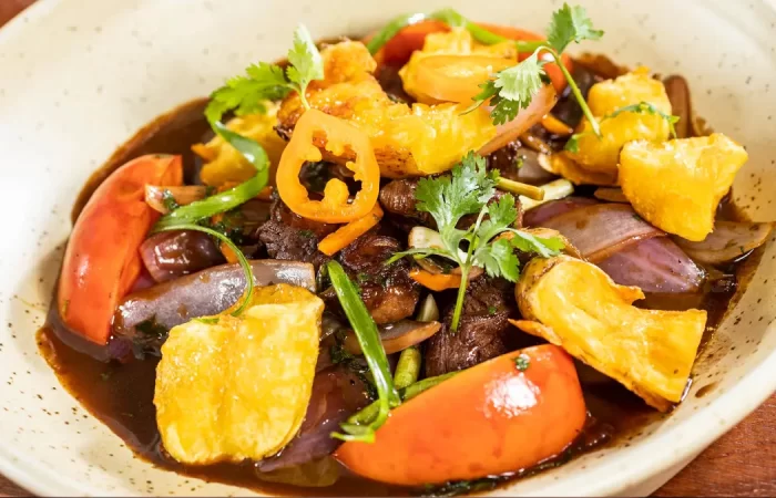 Lomo saltado dish served at Chicha restaurant in Cusco, Peru.