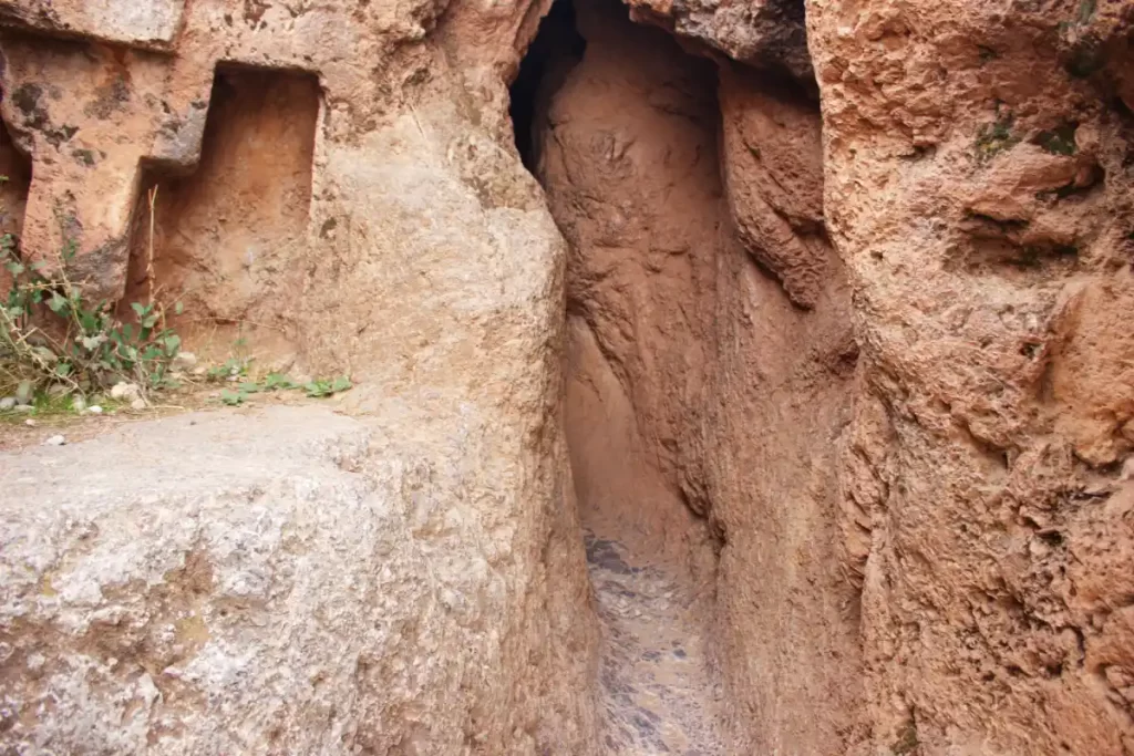 Inside the Inca Chinkana in Cusco (2025): Breakthrough Excavations Beneath Sacsayhuamán 9 Small Chinkana entrance corridor at Sacsayhuamán, showing the central access point clearly illuminated before entering the tunnel.