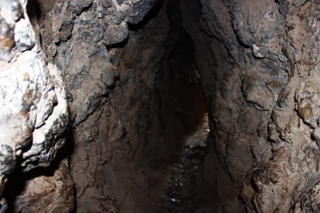 Inside the Inca Chinkana in Cusco (2025): Breakthrough Excavations Beneath Sacsayhuamán 13 Interior stone passage of the Small Chinkana in Sacsayhuamán, Cusco, viewed from inside the tunnel, approaching the exit point.