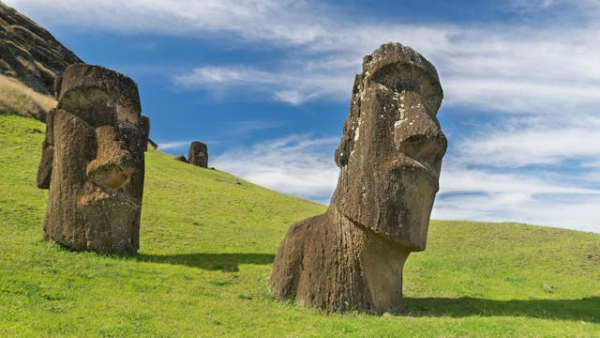 Ancient moai statues standing across the sacred landscapes of Rapa Nui in Easter Island Chile